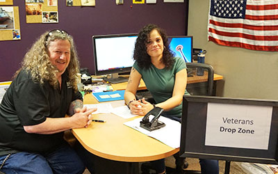 Veterans Services Representatives sitting at desk